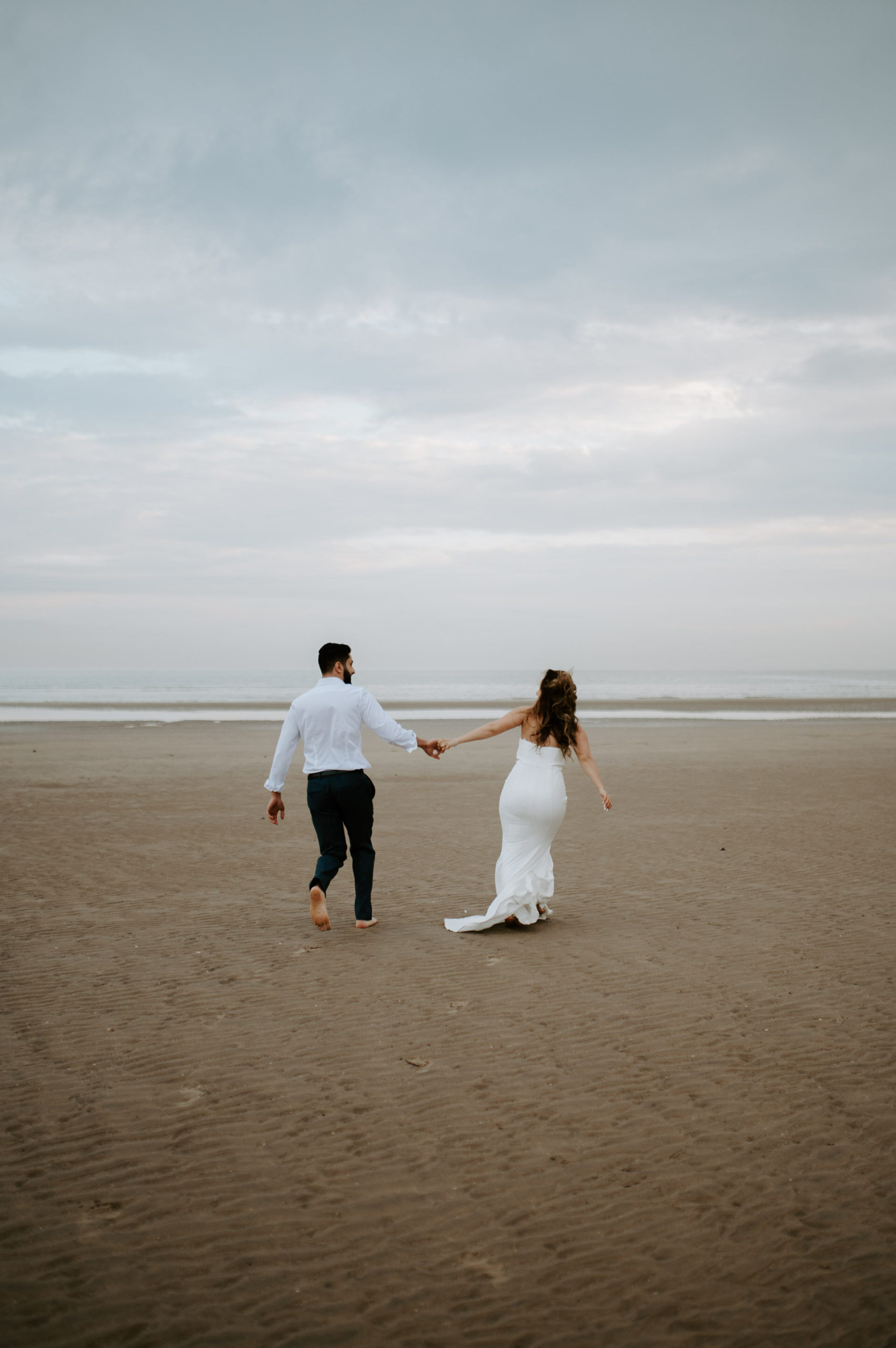 Demiana and Goergeuos - Camber Sands Golden Hour Beach Shoot - Laura Williams Photography-16.jpg