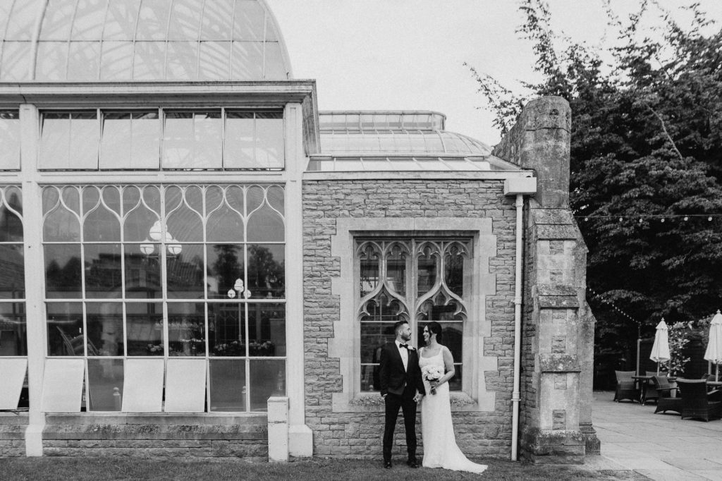 bride and groom outside orangery at tortworth court