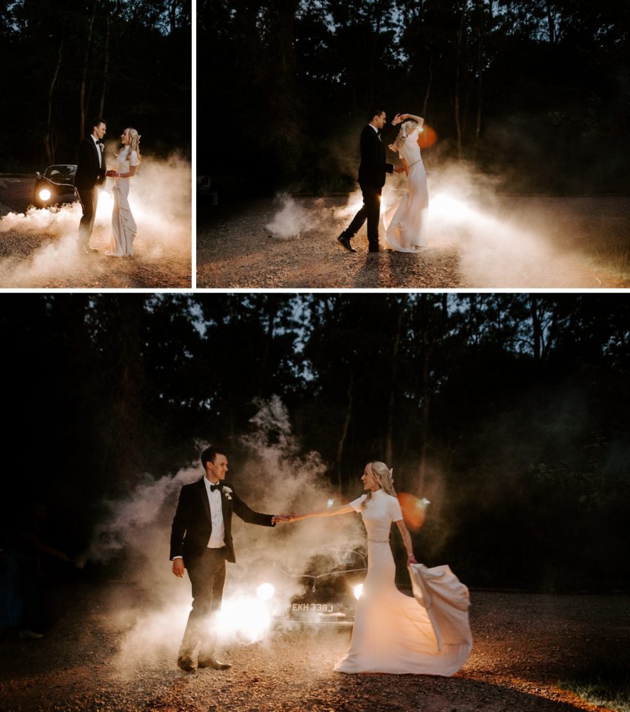 couple at night with vintage wedding car 