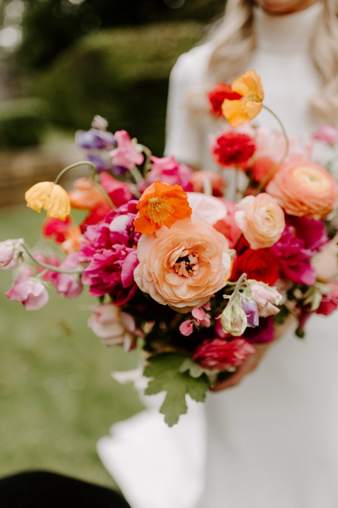 orange pink and red bridal bouquet at West Green house gardens