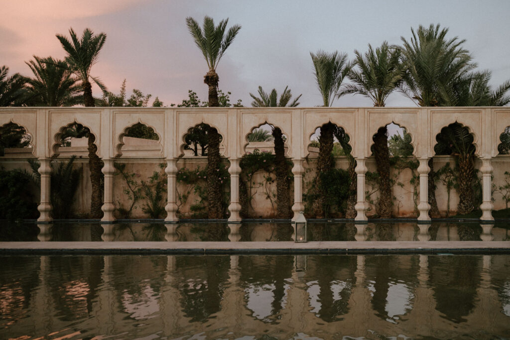 Moroccan arches at palais namaskar luxury marrakesh wedding venue at sunset