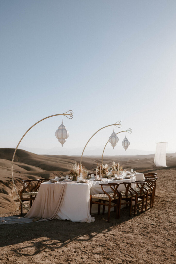 wedding reception set up on sand dune in agafay desert in marrakesh