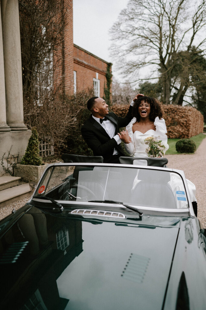 portrait of bride and groom at iscoyd park in wedding car