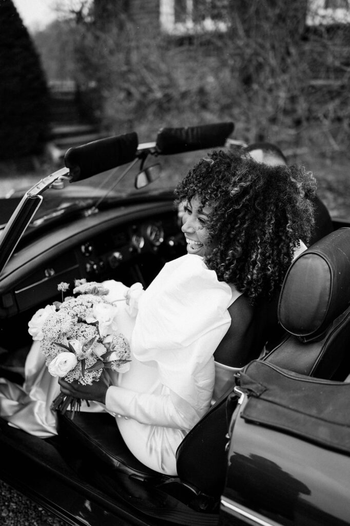 bride and groom in wedding car 