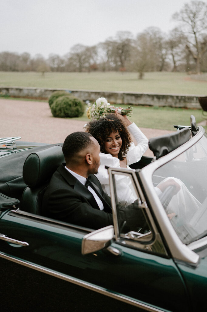 bride and groom in wedding car 