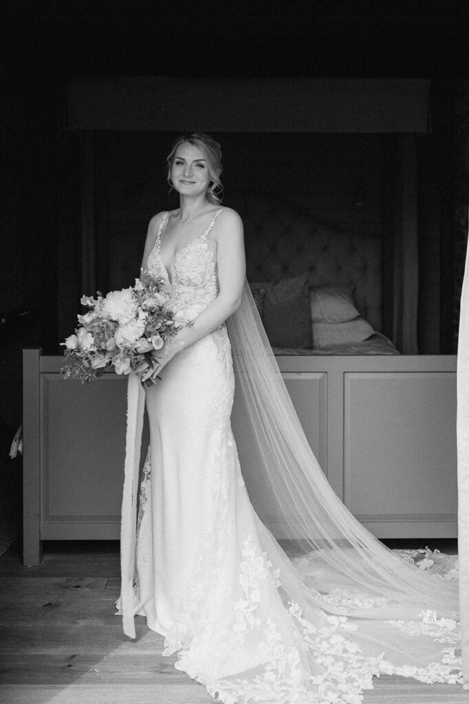 bride wearing Martina liana dress at retreat east Suffolk wedding venue