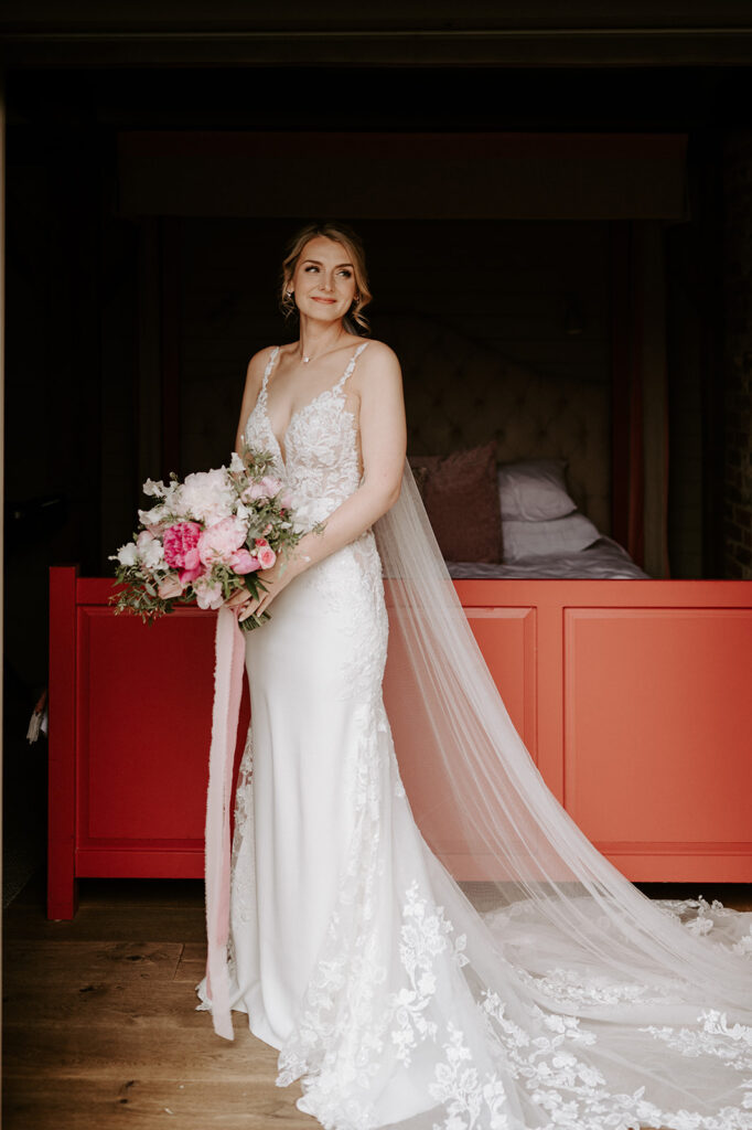 bride wearing Martina liana dress at retreat east Suffolk wedding venue