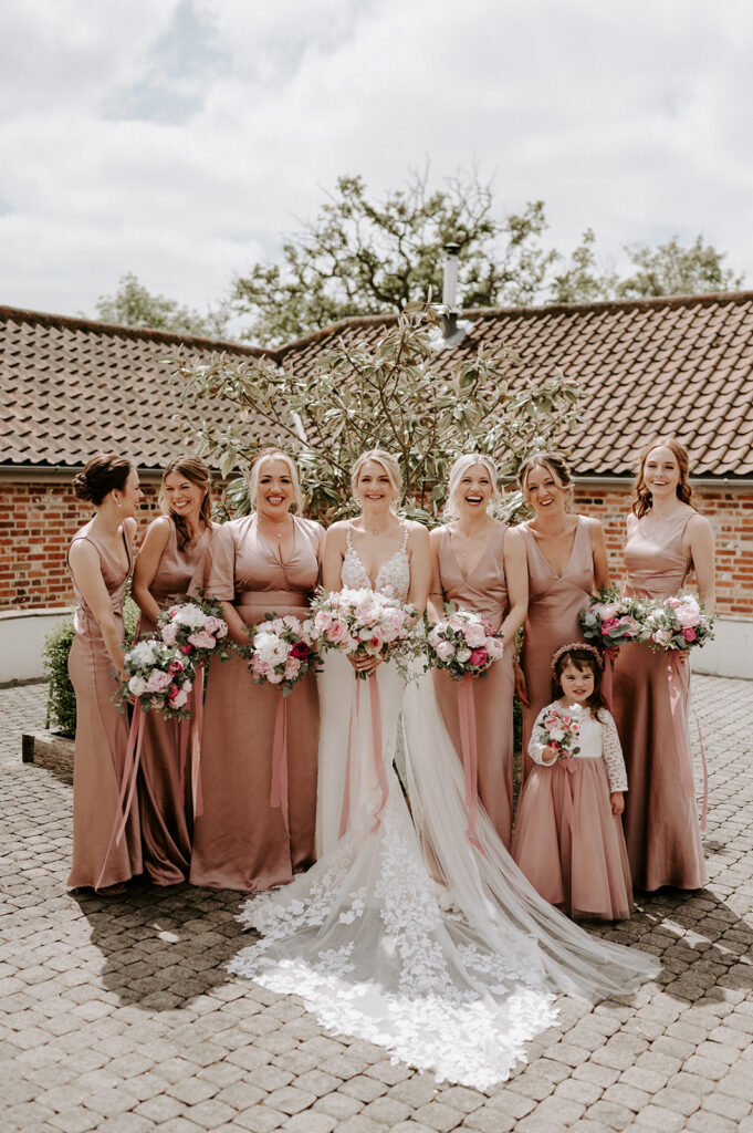 bridesmaids wearing blush pink at retreat east wedding venue