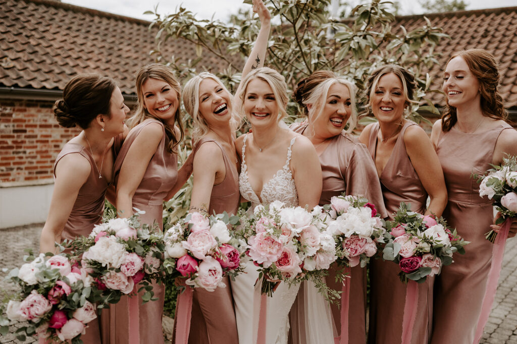 bridesmaids wearing blush pink at retreat east wedding venue
