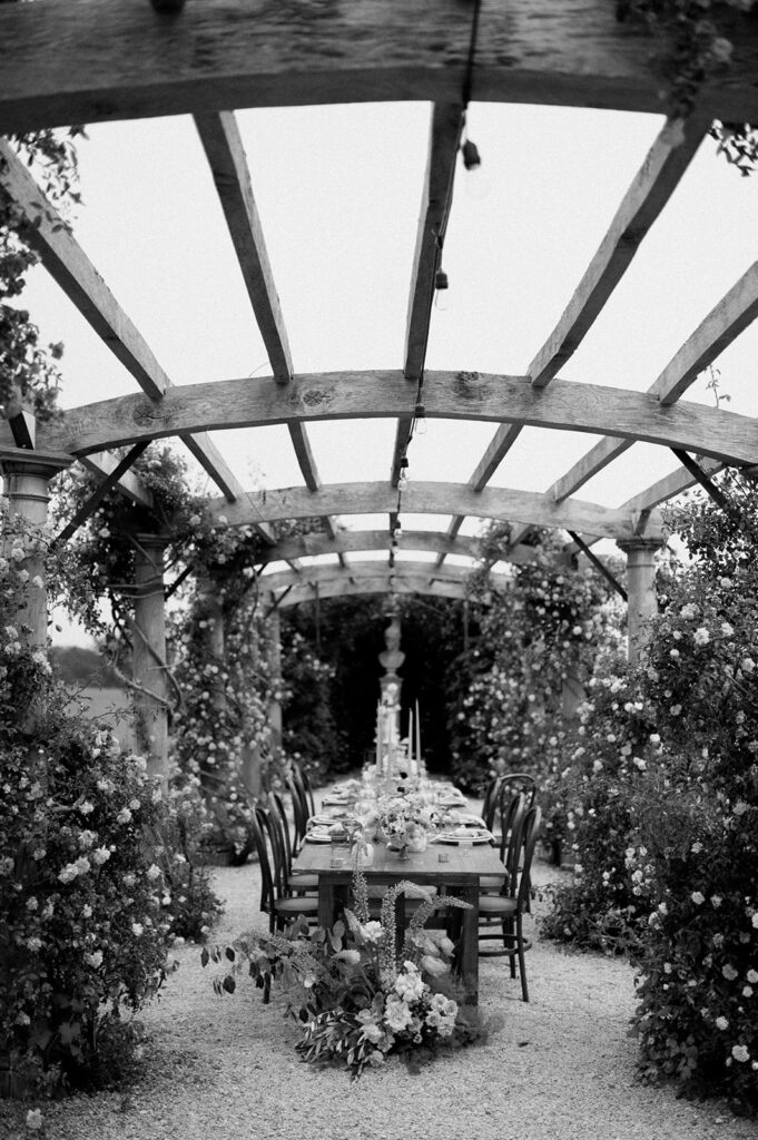 colourful outdoor wedding breakfast set up in gardens of Euridge Manor
