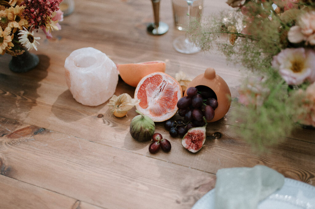 grapefruit, fig, orange, grapes on wedding breakfast table
