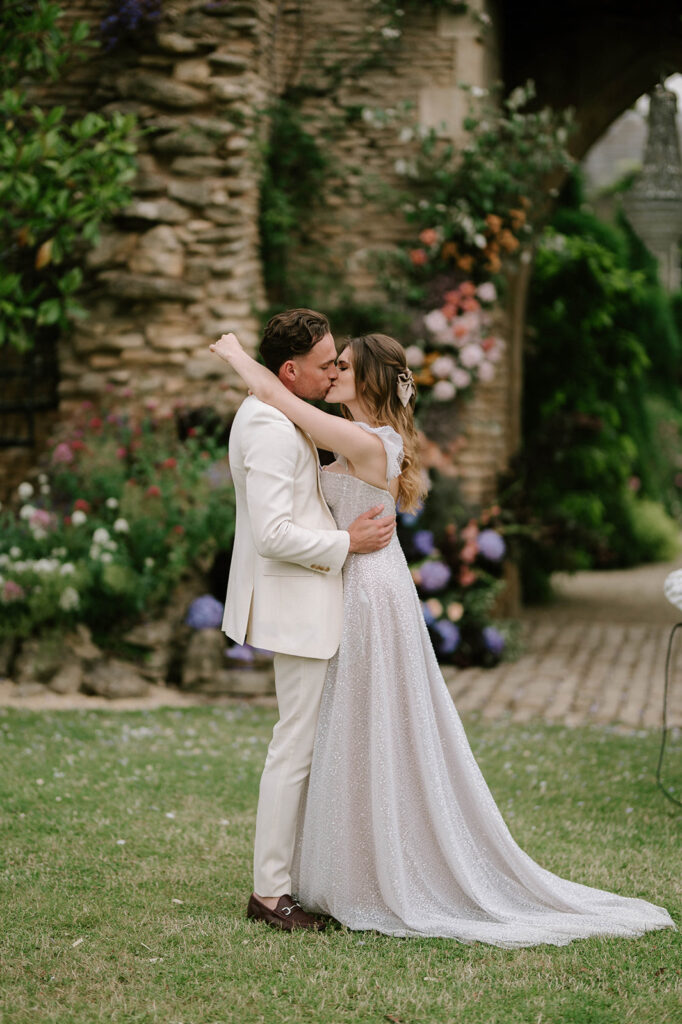 bride and groom having first dance outside in garden at euridge manor