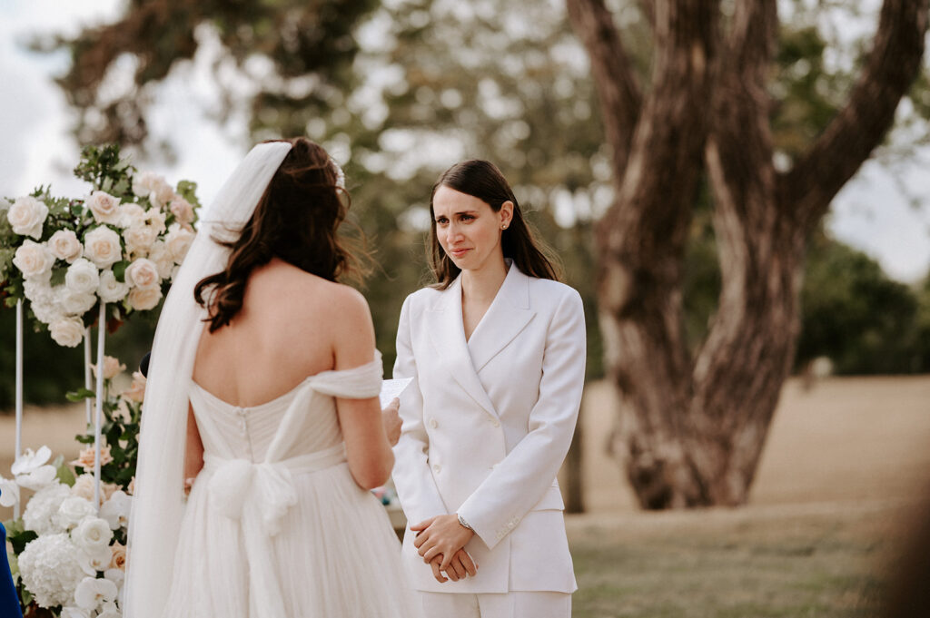 two brides sharing vows