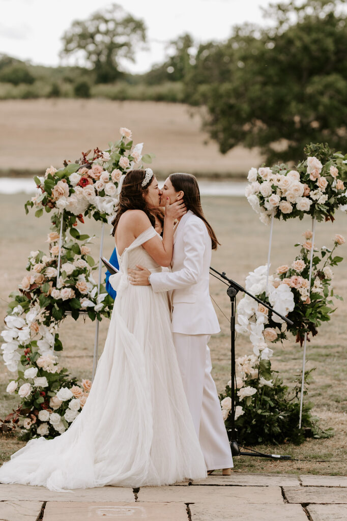 two brides sharing first kiss