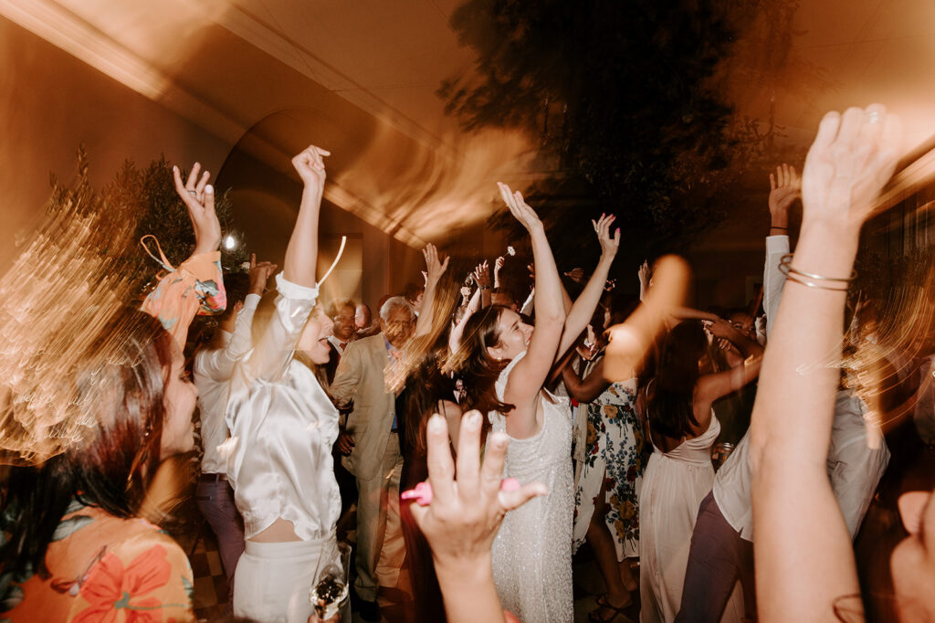 wedding guests dancing with shutter drag