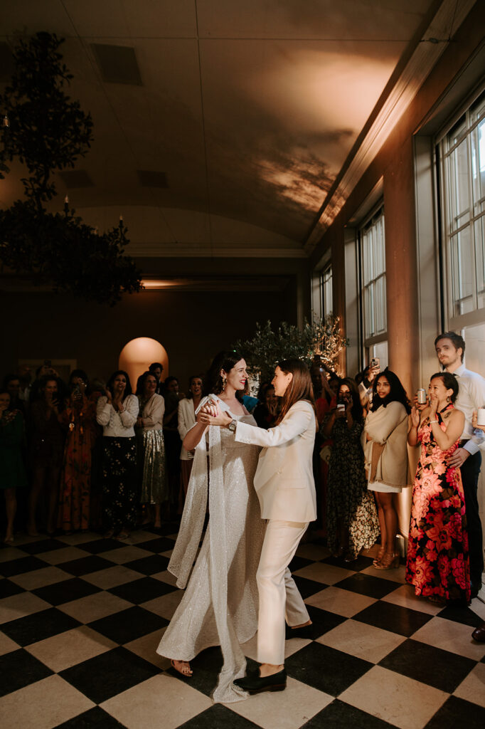 two brides having first dance in orangery at wilderness reserve