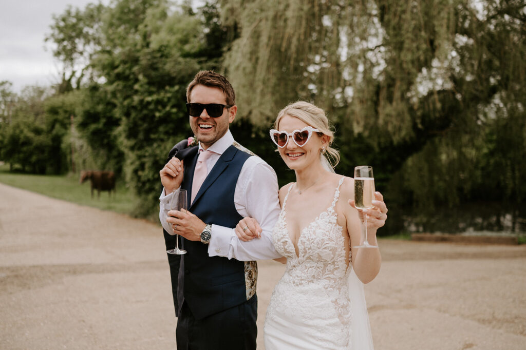 bride and groom wearing sunglasses at retreat east