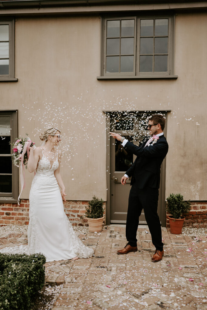 couple throwing confetti 