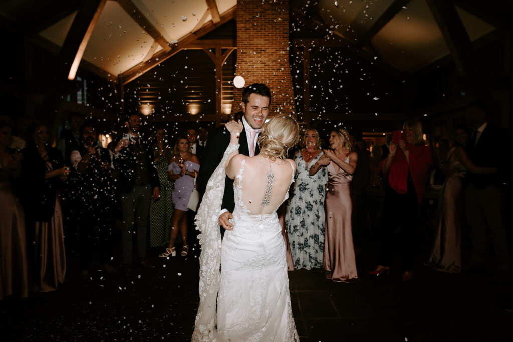 couple having first dance at retreat east with confetti cannons