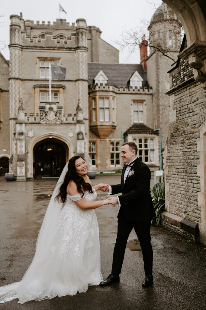 bride and groom dancing in the rain at tortworth court