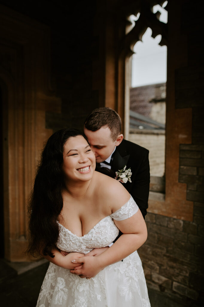 bride and groom embracing at tortworth court