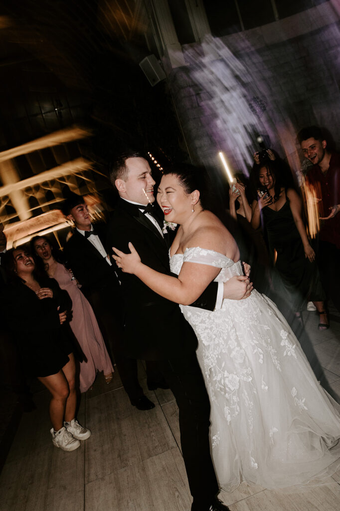 bride dancing with groom on dance floor at tortworth court