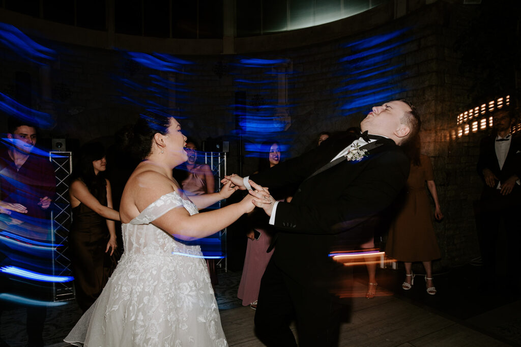 bride dancing with groom on dance floor at tortworth court