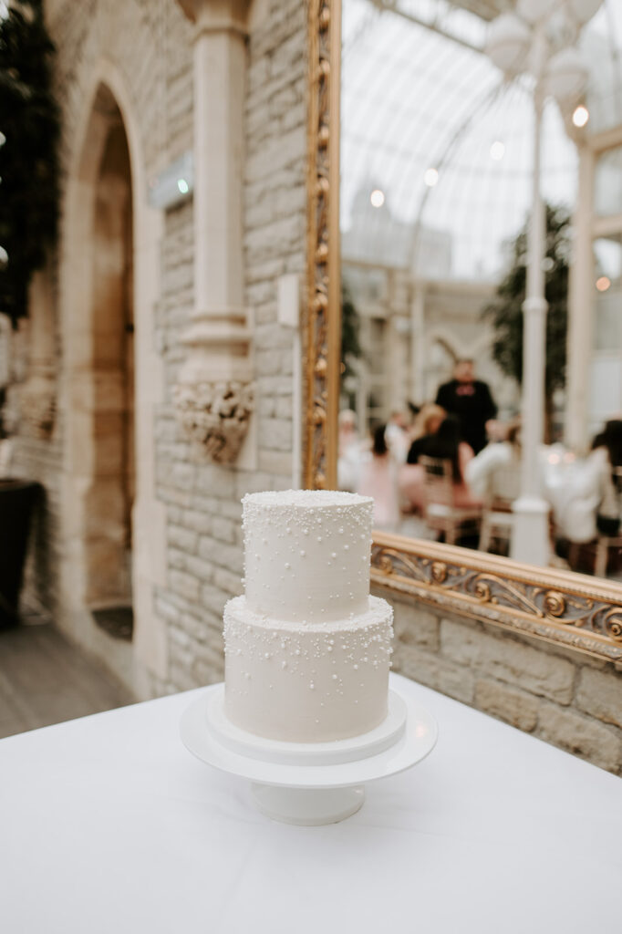 two tier wedding cake with pearls in orangery