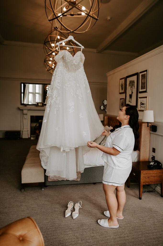 bride playing with dress at tortworth court